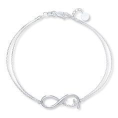 Display your love for your family through this delightful bracelet featuring an infinity symbol with the word "family." The pendant is held by a 7-inch double cable chain that fastens with a lobster clasp. Infinity Family, Bracelet For Her, Trending Bracelets, Silver Ring Designs, Jewelry Education, Jewelry Advice, Kay Jewelers, White Bracelets, Motivational Gifts