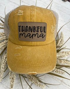 This is so cute for the fall season, or just in general! Distressed mustard yellow baseball cap with a criss cross pony tail back. Hat has a brown engraved patch permanently adhered. All hats ship safely in a brown box. Casual Gold Trucker Hat One Size Fits Most, Gold Casual Trucker Hat, One Size Fits Most, Casual Gold Trucker Hat One Size, Gold Casual Trucker Hat One Size, Gold Casual Trucker Hat, Casual Adjustable Gold Trucker Hat, Casual Adjustable Gold Baseball Cap, Adjustable Brown Baseball Cap With Letter Print, Winter Trucker Baseball Cap Adjustable