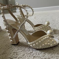 They Were Purchased For My Engagement Shoot - Worn One Time, For One Hour. Purchased Directly From Jimmy Choo And Still Retails For $2,050. No Damage At All, Like New Except For Some Wear On The Soles (As Pictured). They Are Hard To Let Go Of, But I Simply Have No Need To Keep Them. They Are A Size 39 (I Range From A 38-38.5 And Went With The 39) Item No. Sacariapf120woz The Sacaria Platform Sandals Have All-Over Pearl Embellishments. Crafted In Italy From White Satin, This Perfect Evening Or Bridal Pair, Topped With An Oversized Pearl For Maximalist Glamour. Details: Satin Pearl Embellishment Logo-Engraved Large Pearl Open Toe Buckle-Fastening Ankle Strap Leather Sole Heel Height Mea Jimmy Choo Pearl Heels, Jimmy Choo Sacaria, Pearl Embellishment, Jimmy Choo Shoes, Engagement Shoot, Sandal Women, White Satin, Let Go, Platform Sandals