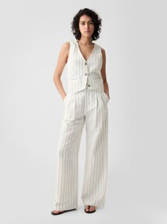 Soft linen-cotton blend trousers.  E-waist with concealed hook and bar closure, zip fly.  Front slant pockets, back welt pockets.  Certain styles have allover prints.  * Fit: Classic.  An easy silhouette that fits close  at the waist, and is relaxed through the hips and thigh.  Note: Mette Linturi is wearing a Gap Cotton Linen Trousers, Miami Outfits, Linen Clothing, Cotton Vest, Straight Leg Trousers, Linen Clothes, Linen Women, Striped Linen, Navy Stripes