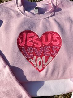 Jesus Loves You embroidered sweatshirts  sweatshirt color on picture is Pink  Super Soft Sweatshirts Embroidered sweatshirts Sleeve lengthLong sleeve Fit-Relaxed fit Style-Sweatshirt Neckline-Round Neck Composition-Cotton 60%, Polyester 40% Care instructions-Machine wash cold Solid-color Pink Long Sleeve Hoodie With Embroidered Text, Pink Long Sleeve Sweater With Embroidered Logo, Pink Long Sleeve Sweatshirt With Embroidered Logo, Pink Long Sleeve Sweatshirt With Embroidered Text, Valentine's Day Pink Sweatshirt With Letter Print, Valentine's Day Pink Letter Print Sweatshirt, Pink Crew Neck Sweatshirt For Valentine's Day, Valentine's Day Pink Crew Neck Sweatshirt, Long Sleeve Pink Sweater With Embroidered Text