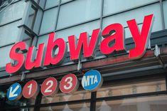 subway sign on the side of a building in london, england stock photos and images