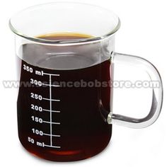 a glass measuring cup filled with liquid