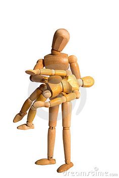 a wooden toy sitting on top of a white surface