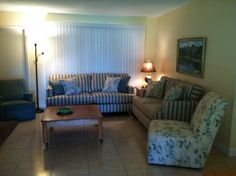 a living room with two couches and a coffee table