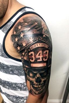 a man's arm with a firefighter skull and american flag tattoo on it