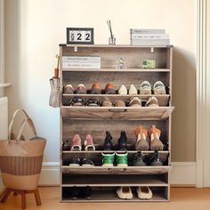 a wooden shoe rack filled with lots of shoes