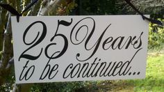 a sign that says 25 years to be contagued hanging from a tree