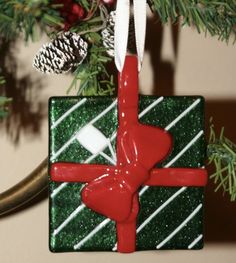 a christmas ornament hanging from a tree