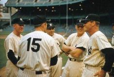 a group of baseball players standing next to each other