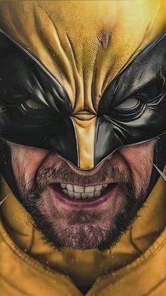 a close up of a person wearing a yellow and black mask with an open mouth