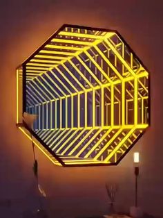 a mirror that is on the wall with neon lights around it and a lamp in front of it