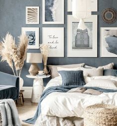 a bedroom with blue walls and pictures on the wall