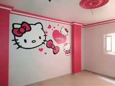 an empty room with hello kitty wall decals on the walls and pink ceiling fan