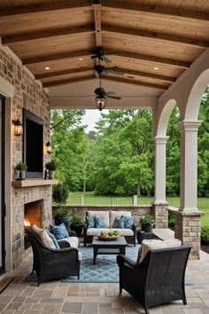 an outdoor living area with couches and chairs