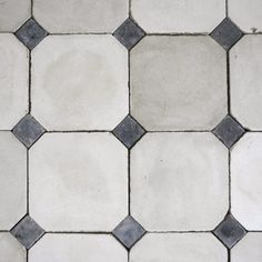 an image of a white and black tile flooring pattern that looks like hexagonal tiles