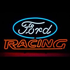 ford racing neon sign on the side of a building