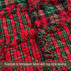 a red and green plaid fabric with fringes