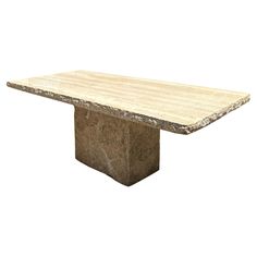 a stone table with a wooden top on a white background