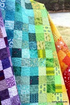 the quilts are all different colors and patterns, but one is multicolored