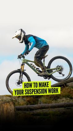 a man on a mountain bike jumping over a wooden fence with the words how to make your suspension work