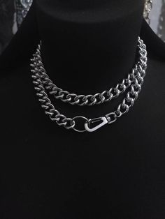 Make an edgy statement with this stunning Chunky Chain Goth Choker Layered Necklace Set! Crafted with steel curb chain and stainless steel push clasp, this modern and sophisticated necklace comes with a bit of punk rock edge, perfect to challenge your style. Light up any outfit and rock the night away! Wear long or doubled as a choker. Total length end-to-end is approximately 32 inches. Cheap Punk Choker For Festivals, Metal Chain Link Necklace For Streetwear, Punk Chain Necklace For Streetwear, Metal Link Necklaces For Streetwear, Streetwear Link Metal Necklaces, Streetwear Metal Link Necklace, Metal Chain Necklace For Streetwear, Streetwear Metal Necklace With Chunky Chain, Adjustable Metal Chain Necklace For Streetwear