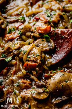 a close up view of some food in a pan with meat and onions on it