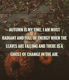 two pumpkins sitting on top of leaves in front of a brick wall with the words autumn is my time i am most radant & full of energy when the leaves are falling and there is a ghost of