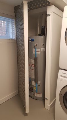 a water heater and washer in a small room