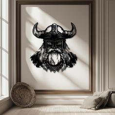 a black and white photo of a viking helmet on a wall in a room with windows