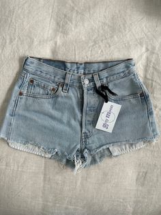 Vintage 501 daisy dukes short shorts. Perfect light wash.  Measurements taken while flat 12 in waist (24 in) 18.5 in hip (37 in) 1 in inseam  10 in rise Light Wash Cutoff Jean Shorts For Spring, Fitted Summer Shorts With Frayed Hem, Light Wash Relaxed Fit Jean Shorts, Light Wash Cutoff Shorts For Spring, Light Wash Relaxed Fit Shorts, Fitted Cutoff Shorts, Vintage Jean Shorts For Summer, Light Wash Summer Shorts, Spring Light Wash Jean Shorts