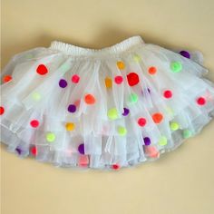 Baby Girl Pom Pom Birthday Tutu Rainbow Pom Poms Brand New Layered Tutu With Pom Pom’s Attached. Available Sizes : 0-6 Months , 6-12 Months, 1-2t Great For Birthday Parties! Pom Pom Birthday, Birthday Tutu, Pom Poms, Kids Bottoms, 6 Months, 12 Months, Birthday Parties, Pom Pom, Kids Shop