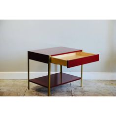 a small table with two drawers on each side