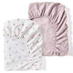 two baby swaddles laying next to each other