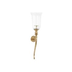 an antique brass wall light with a glass shade on the arm and one candle holder