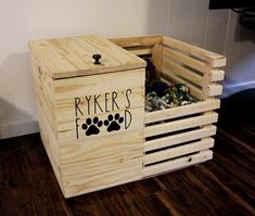 a wooden crate with dog paw prints on it