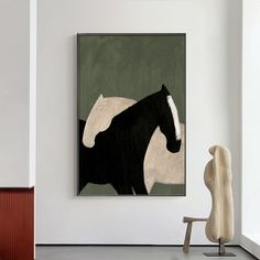 a black and white horse standing in front of a painting on the wall next to a chair