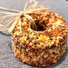 a bundt cake covered in nuts and corn