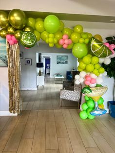 a room filled with lots of balloons and decorations