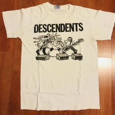 Descendents T Shirt S-3XL Gildan REPRINT Oversized Album Singer Vintage Rock DESCRIPTION * Our great t-shirt is made of 100% Cotton jersey. * Gildan 5000 - High Quality * High-quality and Heavyweight * Classic fit * Weight 6 oz (10.0 oz/ly, 203 g). * Set-in rib collar with shoulder-to-shoulder taping * Double-needle bottom hem and sleeves * Preshrunk to minimize shrinkage * This graphic is printed on top quality cotton t-shirt using high performance Direct to Garment (DTG) printing technology to Rock Vintage, Vintage Rock, Ex Machina, Band Shirts, Great T Shirts, Dream Clothes, Favorite Shirts, Vintage Tshirts, Cool Shirts