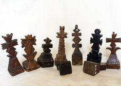 an assortment of carved wooden chess pieces