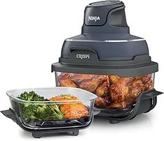 an image of a food processor with chicken and broccoli in it