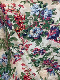 the fabric is very colorful and has flowers on it