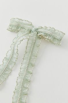 Hair clip trimmed with a textured lace hair bow for a coquette-cool look. Features Textured lace bow hair clip Lace hair bow with a textured finish Secure hair clip backing Content + Care Polyester, mixed metal Spot clean Imported | Textured Lace Bow Hair Clip in Light Green, Women's at Urban Outfitters Bow Things, Bows For Hair, Cottagecore Hair, Lace Hair Bow, Hair Stripping, Mini Hair Bows, Scream 3, Lace Bonnet, Bow Light