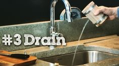 a person pouring water into a kitchen sink with the words 3 drain overlaying it