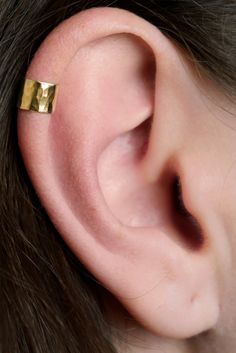 This Wide Hammered Ear Cuff is bold and striking. It is a head turner by itself, or a great compliment to pair with with other jewelry. It is non pierced, and hugs the side of your ear securely and comfortably. Available in these quality Metals: * 14K Gold Filled * Sterling Silver * Rose Gold Filled This piece will arrive in a Gift Box and include simple fitting instructions. Perfect for gift giving Affordable Gold Minimalist Ear Cuff, Modern Adjustable Cartilage Earrings For Everyday Wear, Eat Cuffs, Dainty Yellow Gold Sterling Silver Ear Cuff, Minimalist Gold Tarnish-resistant Ear Cuff, Ear Images, Minimalist Hypoallergenic Gold-plated Ear Cuff, Minimalist Gold Ear Cuff, Nickel Free, Simple Ear Cuff