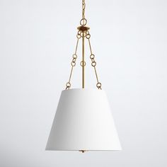 a light fixture with a white shade hanging from the ceiling