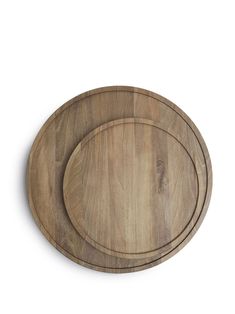 an oval wooden cutting board on a white background