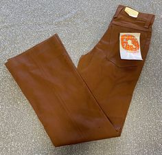 Vintage 1970's Boys brown Fashion Flares denim bellbottom/ Boot cut jeans.  poly/cotton Size 12 Slim, Inseam 25.5", Waist 23.  These jeans are original 1970's deadstock, unworn with original tags! Retro Stretch Flare Jeans, Retro Brown Jeans For Fall, Retro Brown Fall Jeans, Brown Retro Fall Jeans, Vintage Fitted Flare Jeans For Fall, Fall Vintage Fitted Flare Jeans, Vintage Flare Bottoms For Fall, Vintage Pants With Standard Cut Leg For Fall, Vintage Standard Cut Leg Pants For Fall