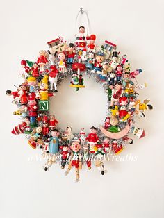 a christmas wreath made out of toy figurines